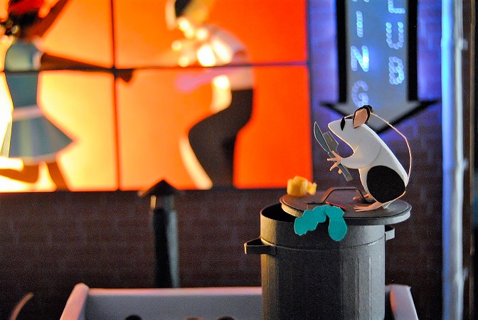 Paper art - A rat enjoys the Swing show at the restaurant in the garbage can on a rooftop. Diorama detail.