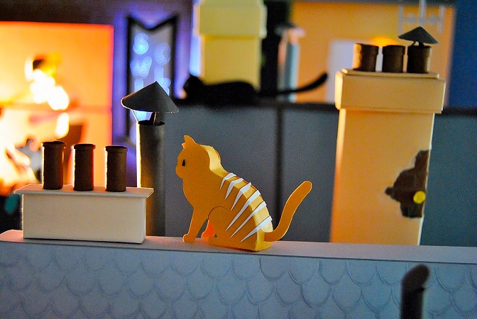 Paper art - One of the cats watching the Swing club show from the rooftops of the big city. Miniature. Detail.