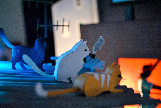 Paper art - A group of sybaritic cats enjoy the music on top of an uralite roof. Miniature detail.