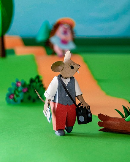 Paper art - A new character appears on the forest road. A mouse journalist looking for news. Paper diorama.