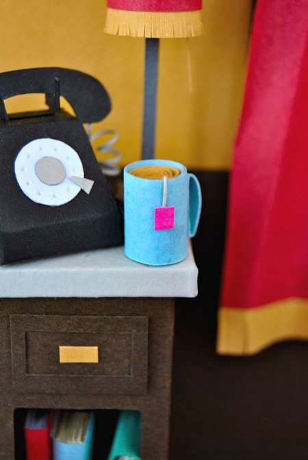 Paper art - Detail. Sidetable with phone, cup of tea and lamp. Miniatures.