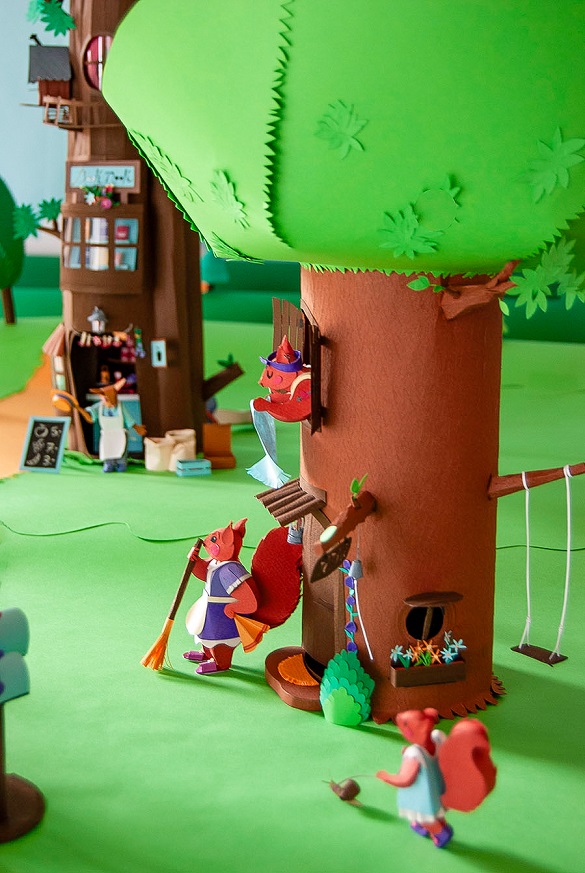 Paper art - Directly in front of the grocery tree is the lovely tree in which a family of three squirrels lives. Paper diorama.