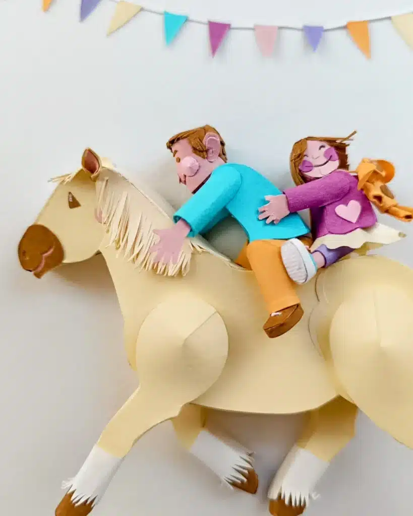 Paper Art - Paper horse ridden by two children. Paper sculpture.